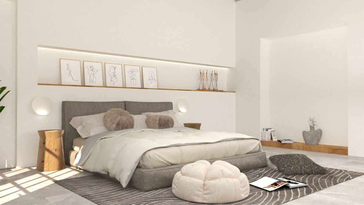 Wide bedroom view with low bed, recessed shelf and soft furnishings