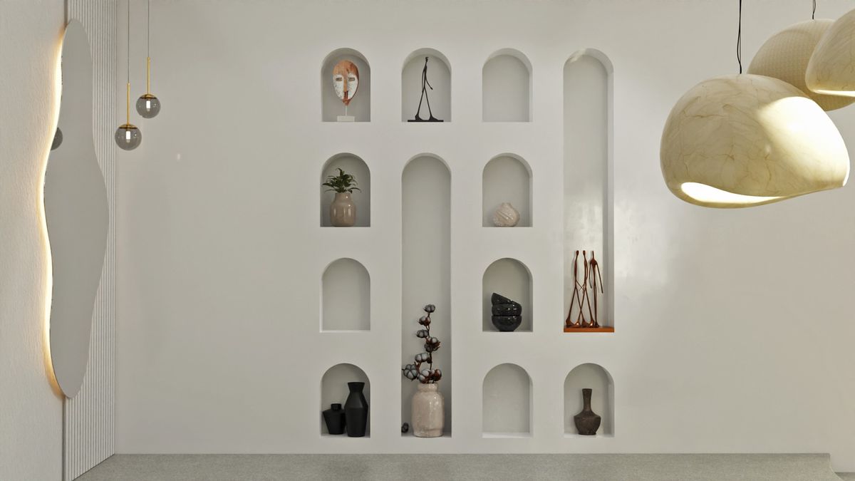 Arched wall niches with curated objects and sculptural lighting